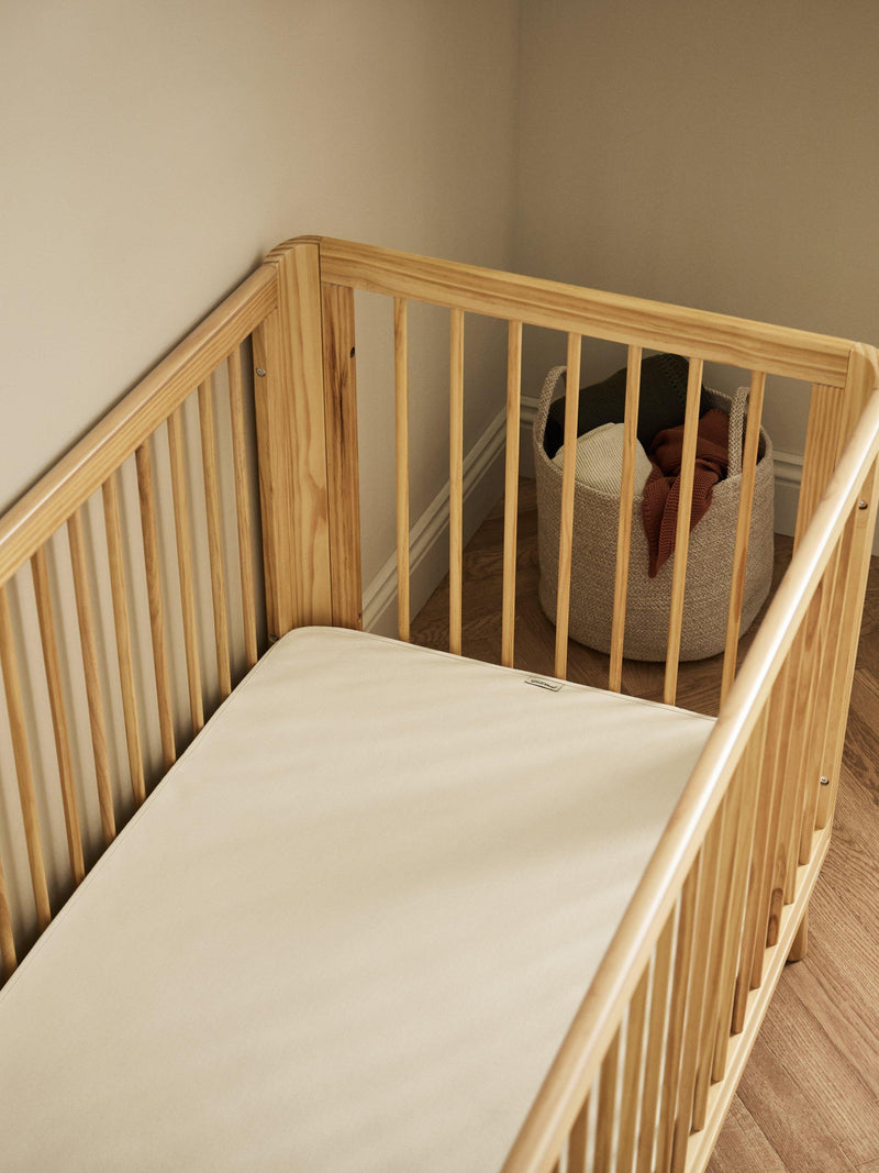 The Little Green Sheep waterproof cot mattress protector (British brand)