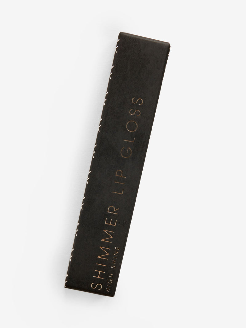 Lightly tinted pink spritz shimmer lip gloss (British brand)