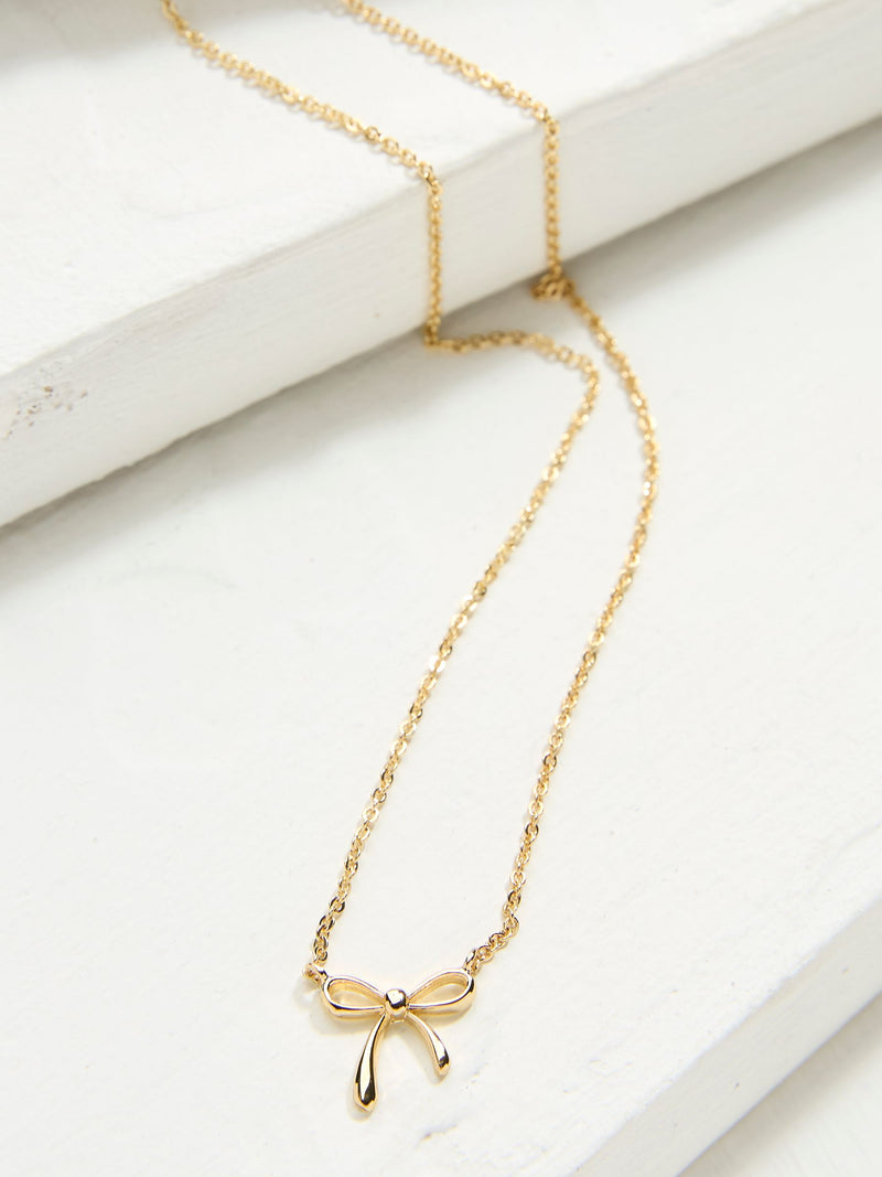 FatFace Gold Tone Bow Pendant Necklace