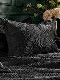 Paoletti Black Palmeria quilted velvet duvet cover set, imported from the UK