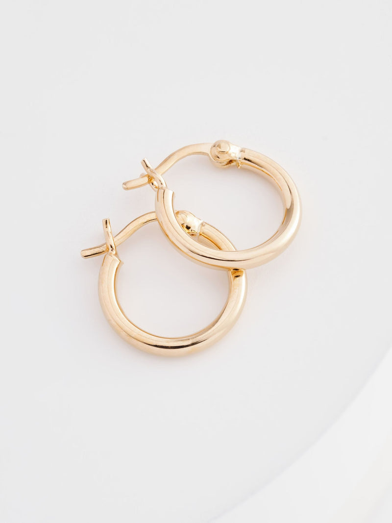 Gold plated sterling silver mini hoop pierced earrings, UK version