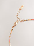 Orange beaded anklet, imported from the UK