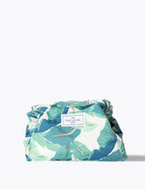 The Flat Lay Co. Open Flat Makeup Bag In Tropical Leaves Travel Makeup Organiser 52cm Diameter