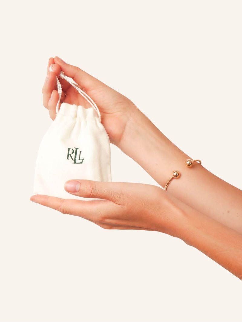 Lauren Ralph Lauren gold tone faux pearl earrings with crystal logo, UK version