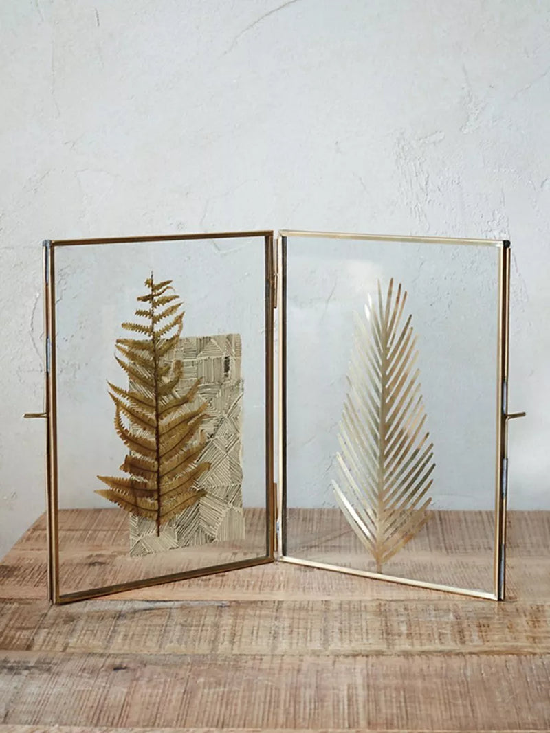 Nkuku antique brass folding photo frame for portrait display, imported from the UK