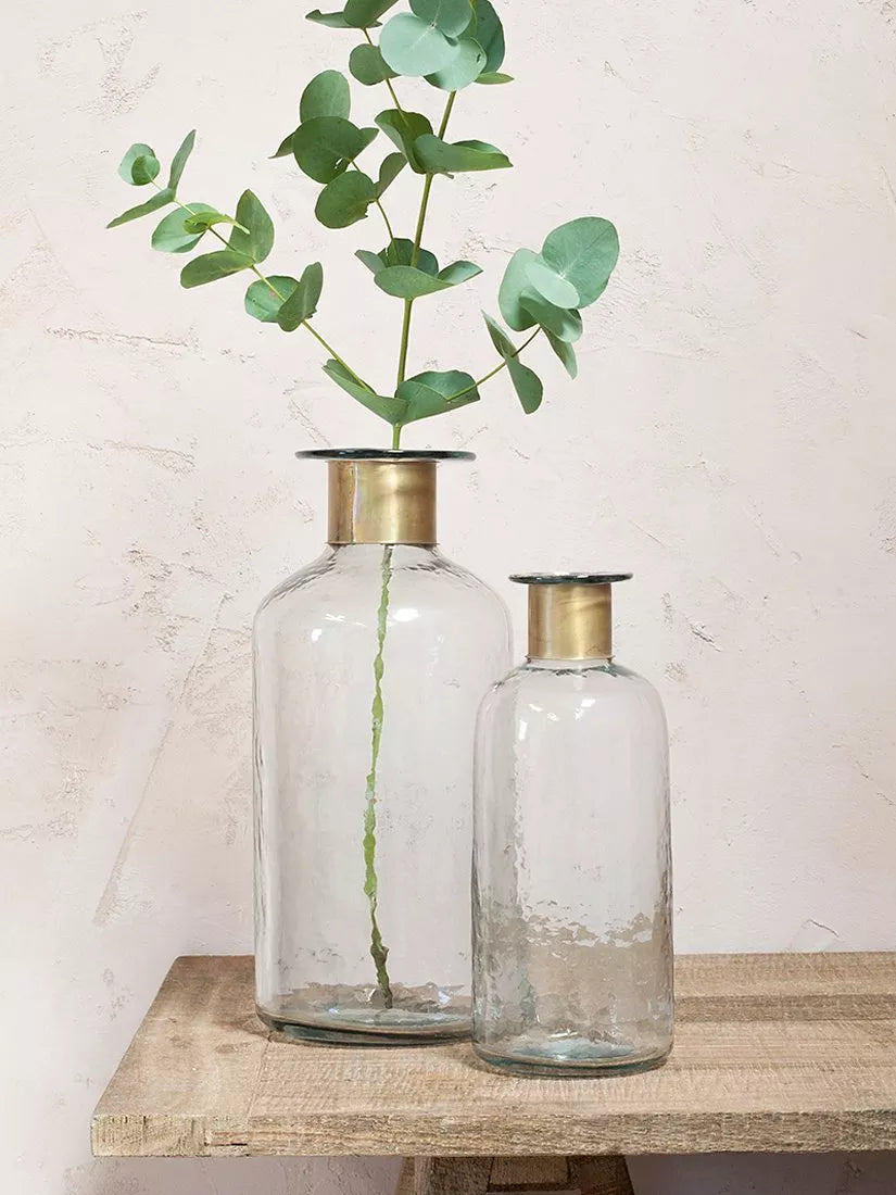 Nkuku Chara hammered glass bottle vase in Clear, imported from the UK