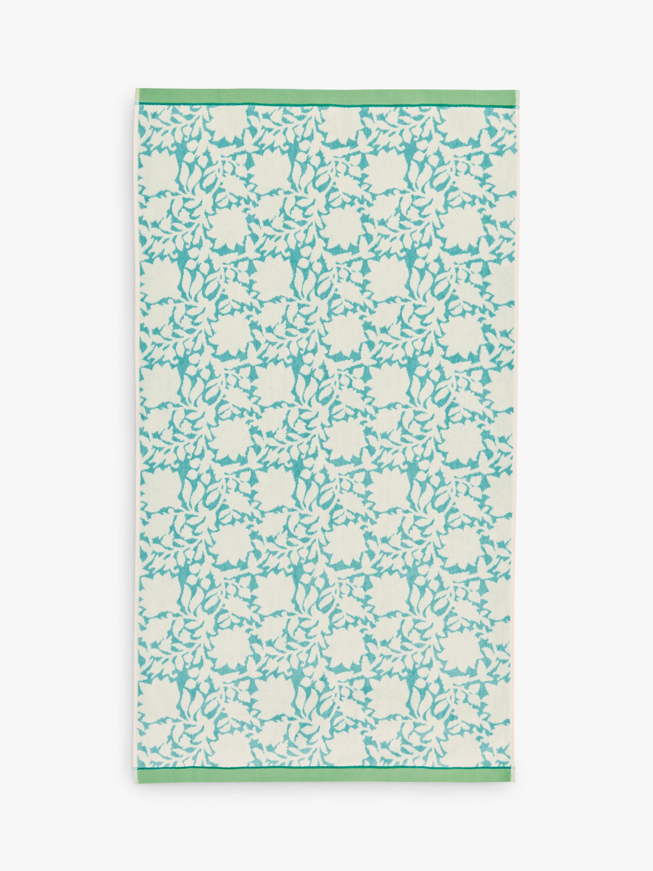 Land Shore floral blue bath towel with red and green trim, UK version