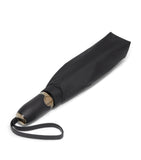 Tumi medium umbrella with red accents and reflective trim (British brand)