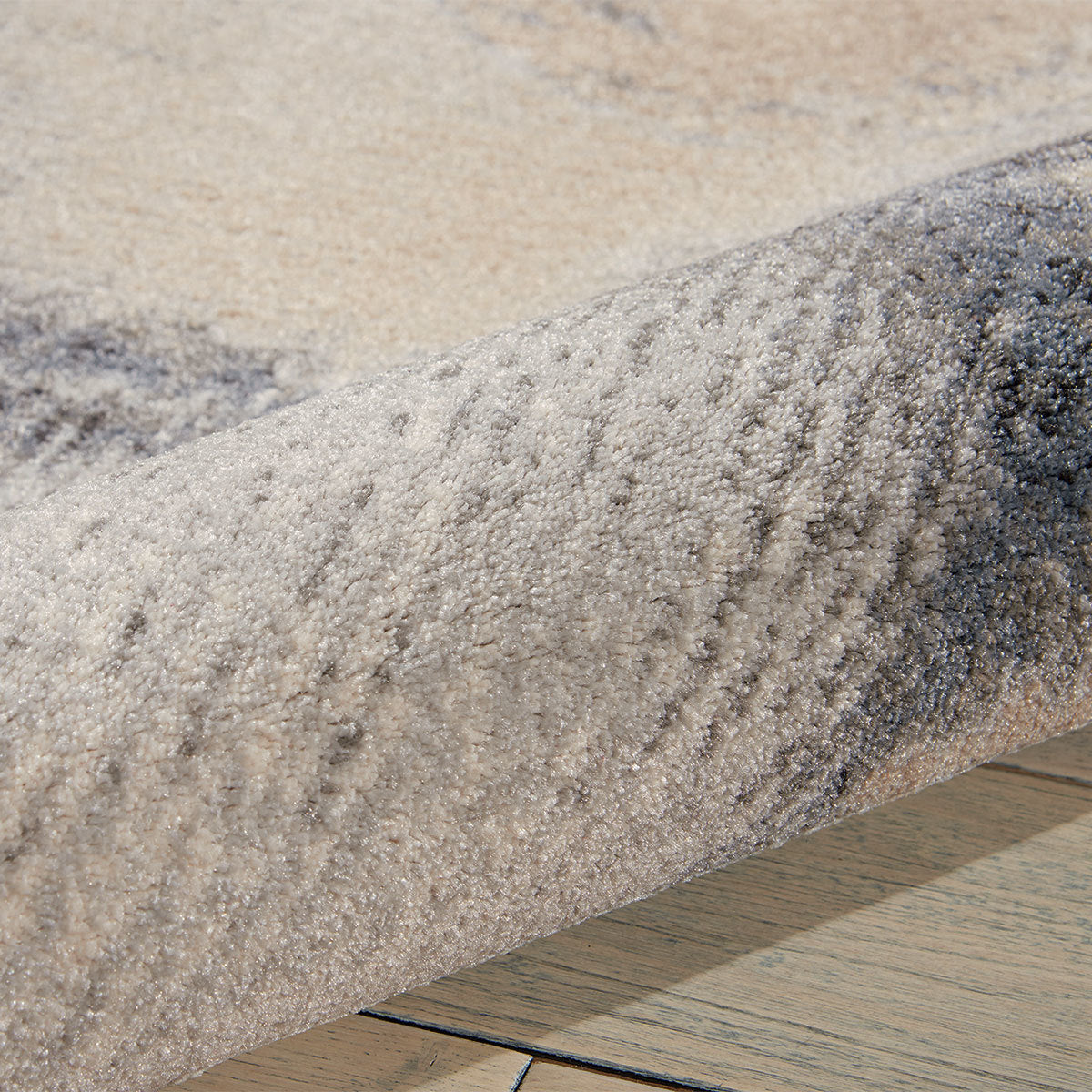 Nourison grey skies design polyester rug available in three sizes, imported from the UK