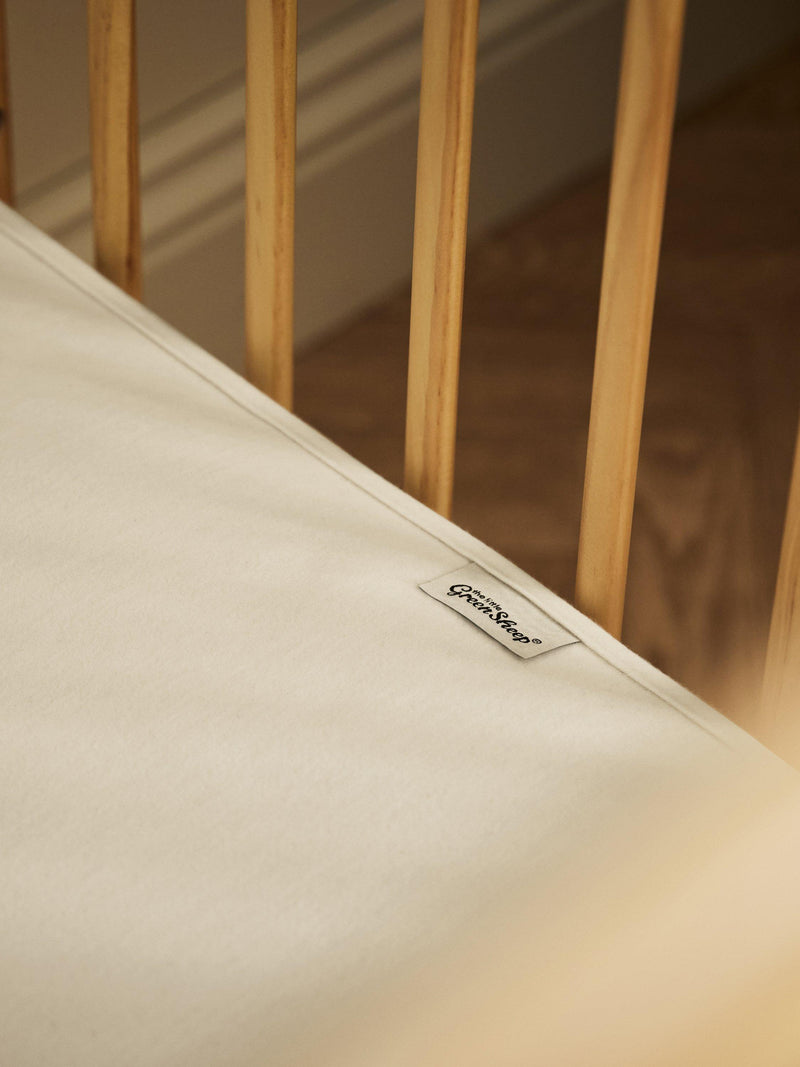 The Little Green Sheep waterproof cot mattress protector (British brand)