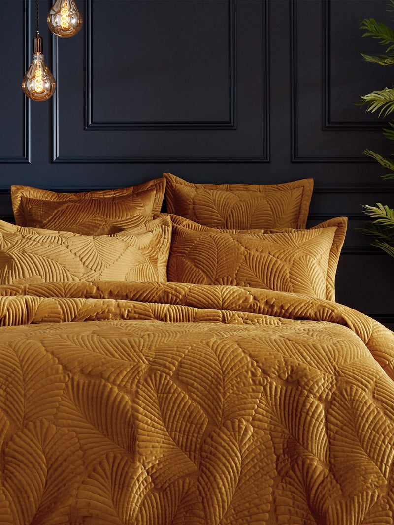 Paoletti gold quilted velvet duvet cover and pillowcase set, imported from the UK