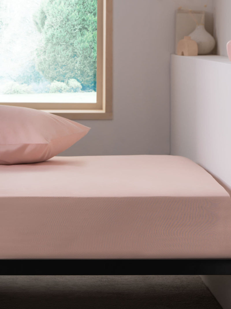 Pink easy-care polycotton fitted sheet, imported from the UK
