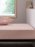 Pink easy-care polycotton fitted sheet, imported from the UK