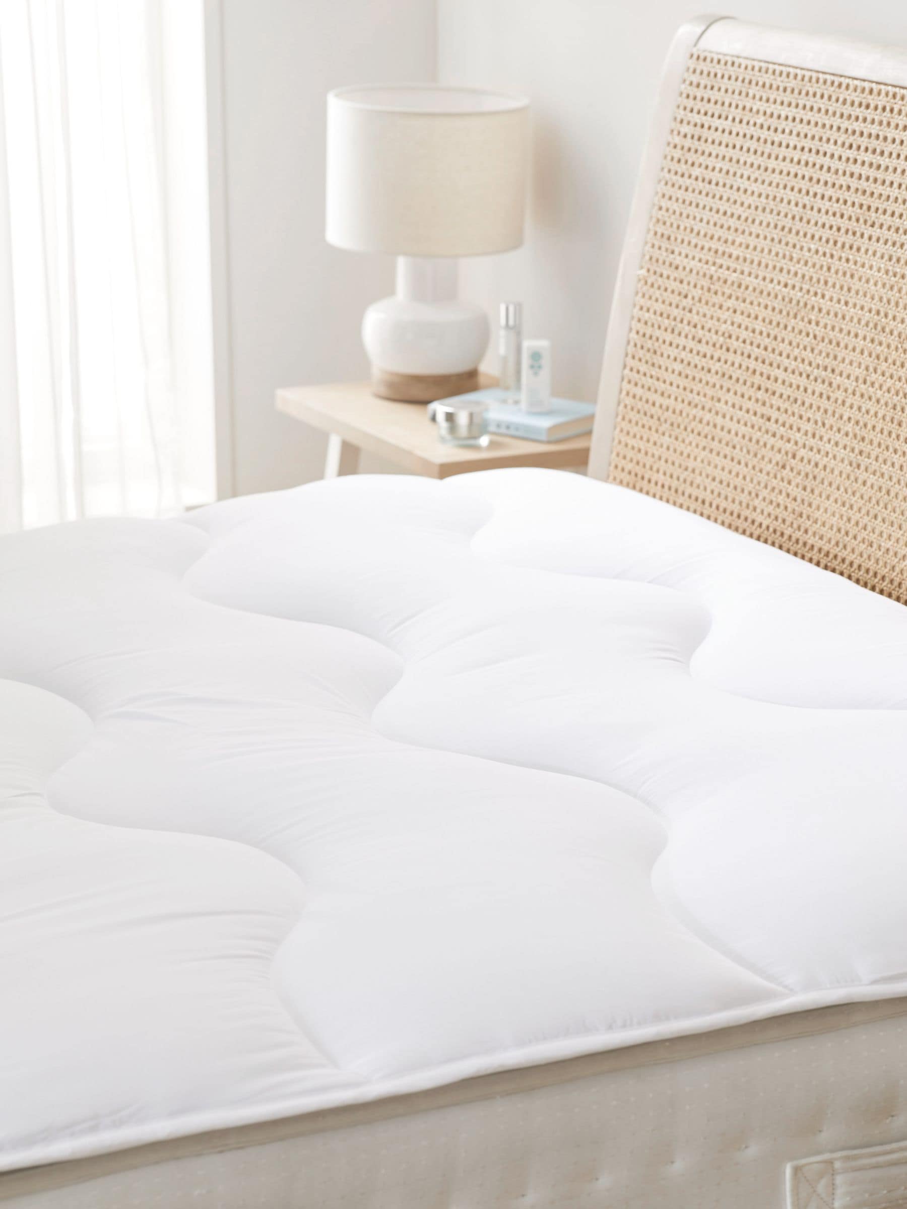 White mattress topper with dual layer design (British brand)