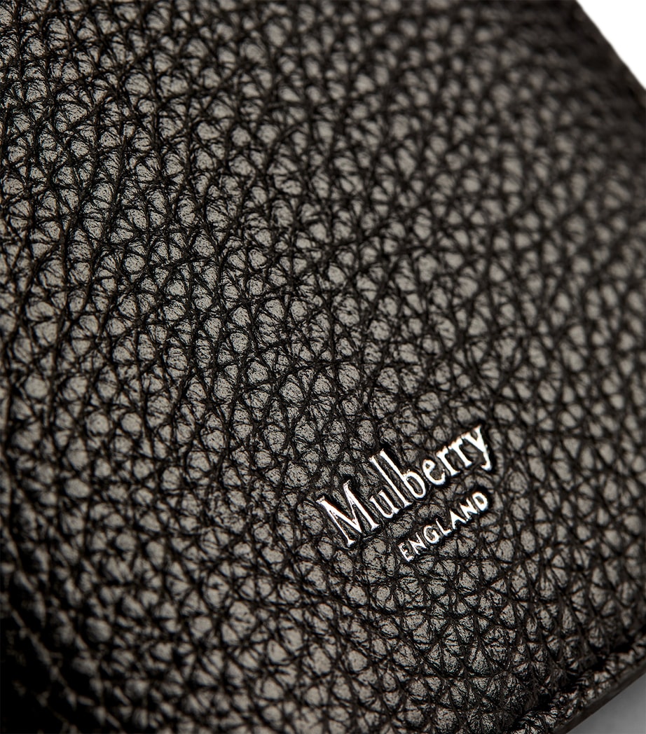Mulberry grained leather passport holder with slimline design, imported from the UK