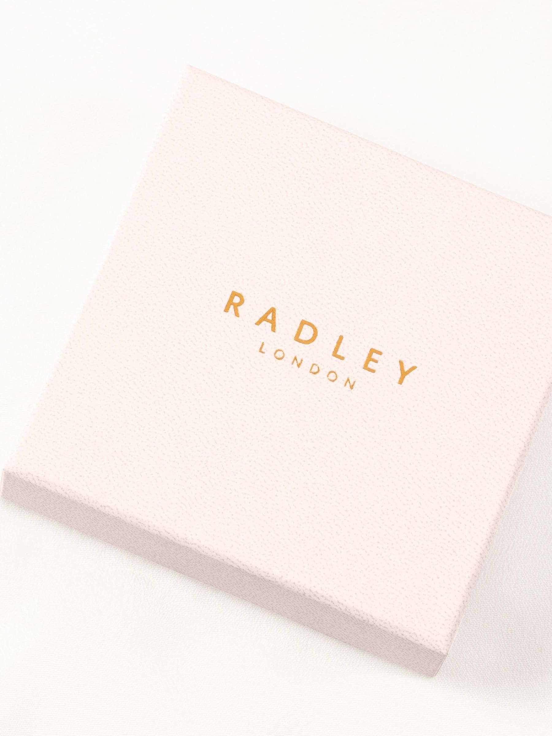 Radley ladies silver tone jumping dog charm bracelet, imported from the UK