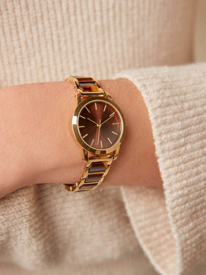 Gold tone tortoiseshell link bracelet watch, 3cm diameter, UK version