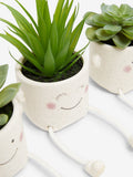 Set of 3 green artificial dangly succulents in character pots (British brand)