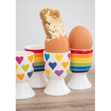 KitchenCraft ceramic egg cup set with rainbow stripes and heart pattern, UK version