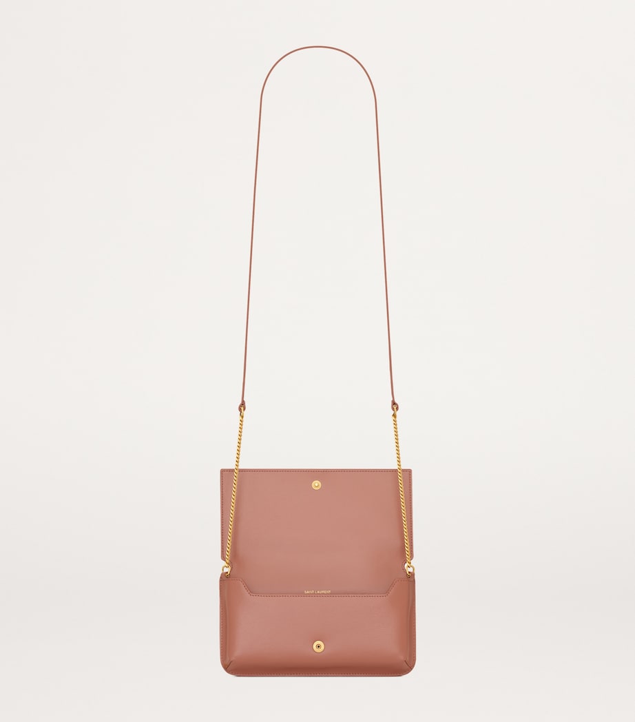 Saint Laurent leather Cassandre phone holder with chain strap, 11x18x2.5cm (British brand)