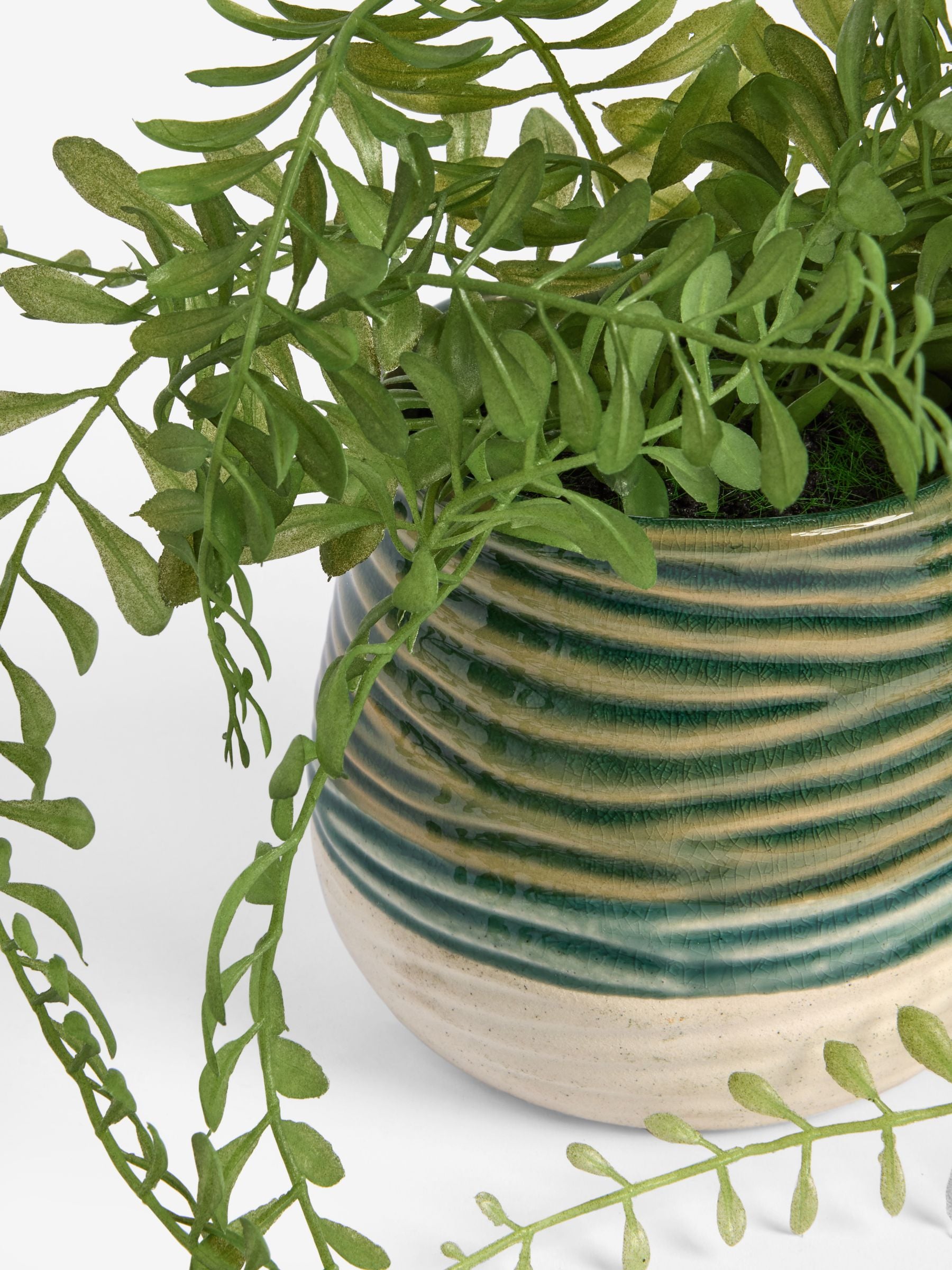 Green artificial trailing plant in reactive ceramic pot, 33cm height, UK version