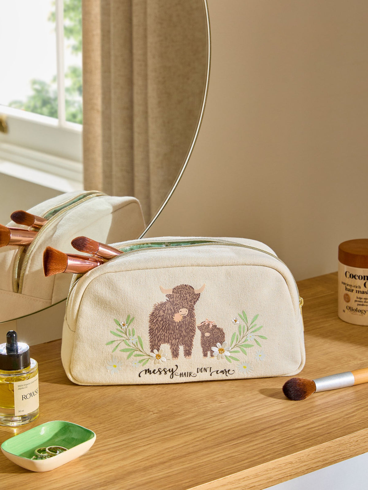 Makeup bag featuring Hamish the Highland Cow design, imported from the UK