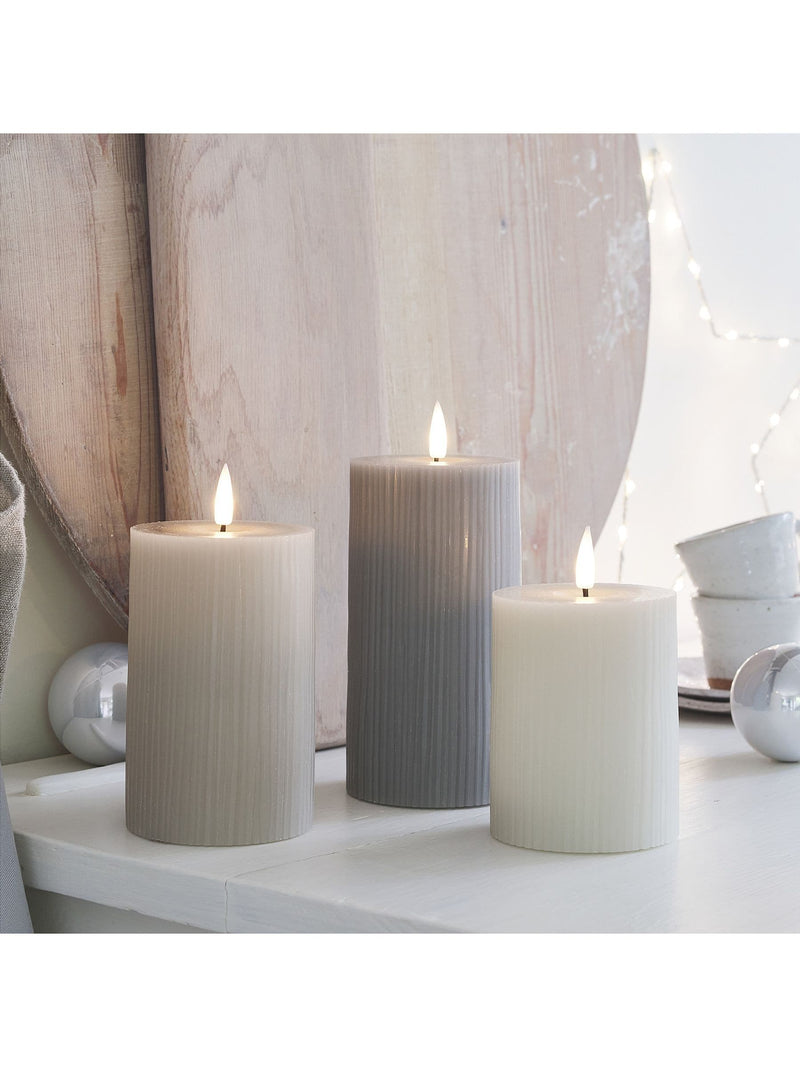 Lights4fun grey ribbed pillar LED candle trio with varying heights, UK version