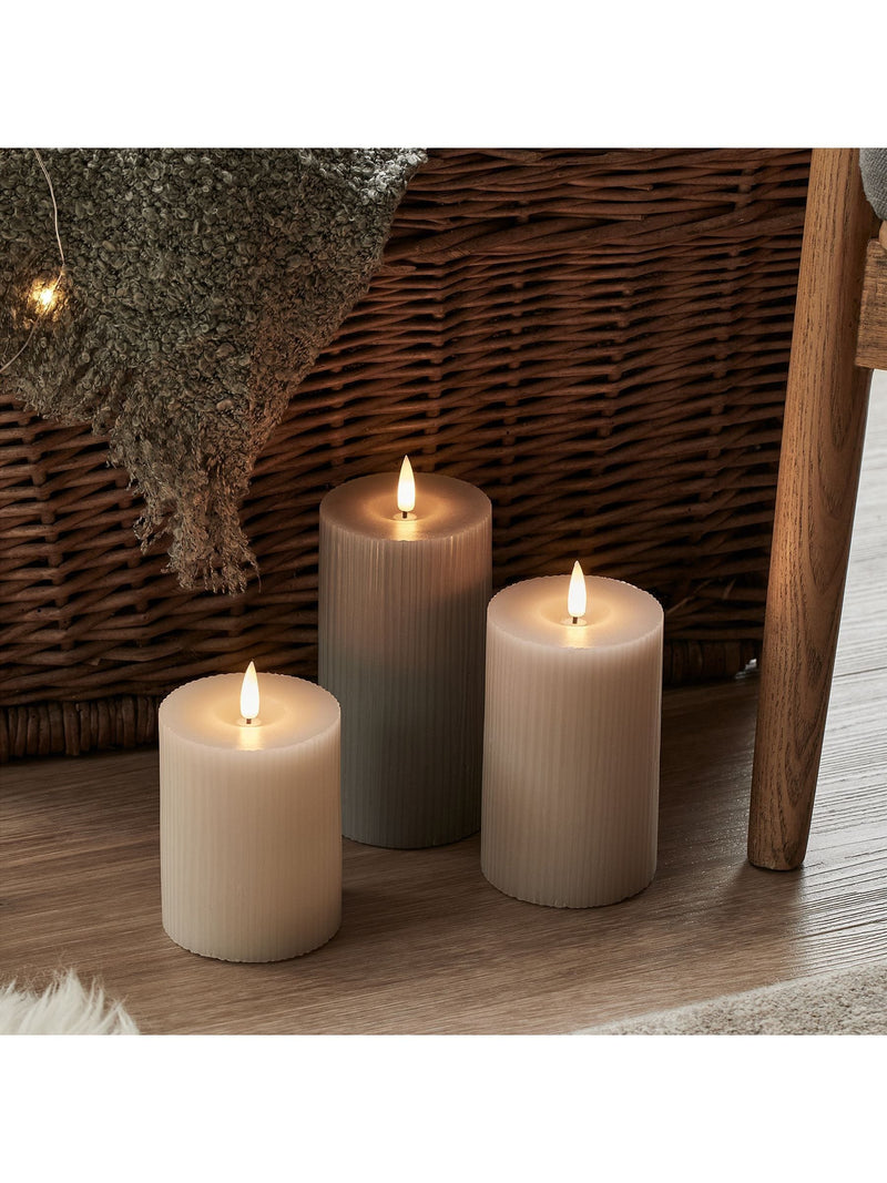 Lights4fun grey ribbed pillar LED candle trio with varying heights, UK version