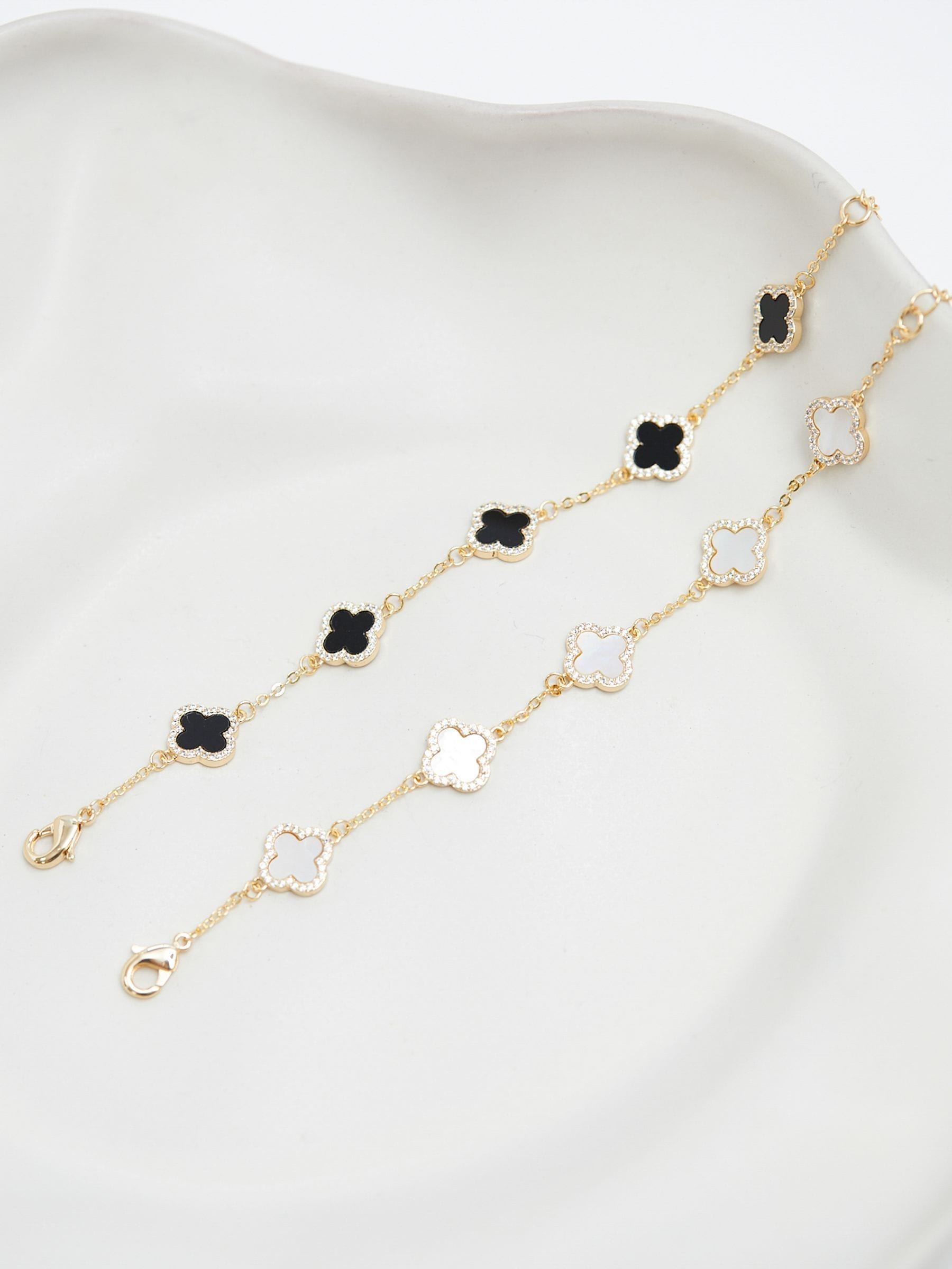 Jon Richard gold tone jet enamel clover bracelet 178mm, UK version