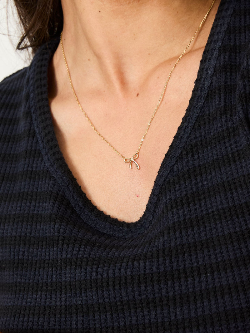 FatFace Gold Tone Bow Pendant Necklace