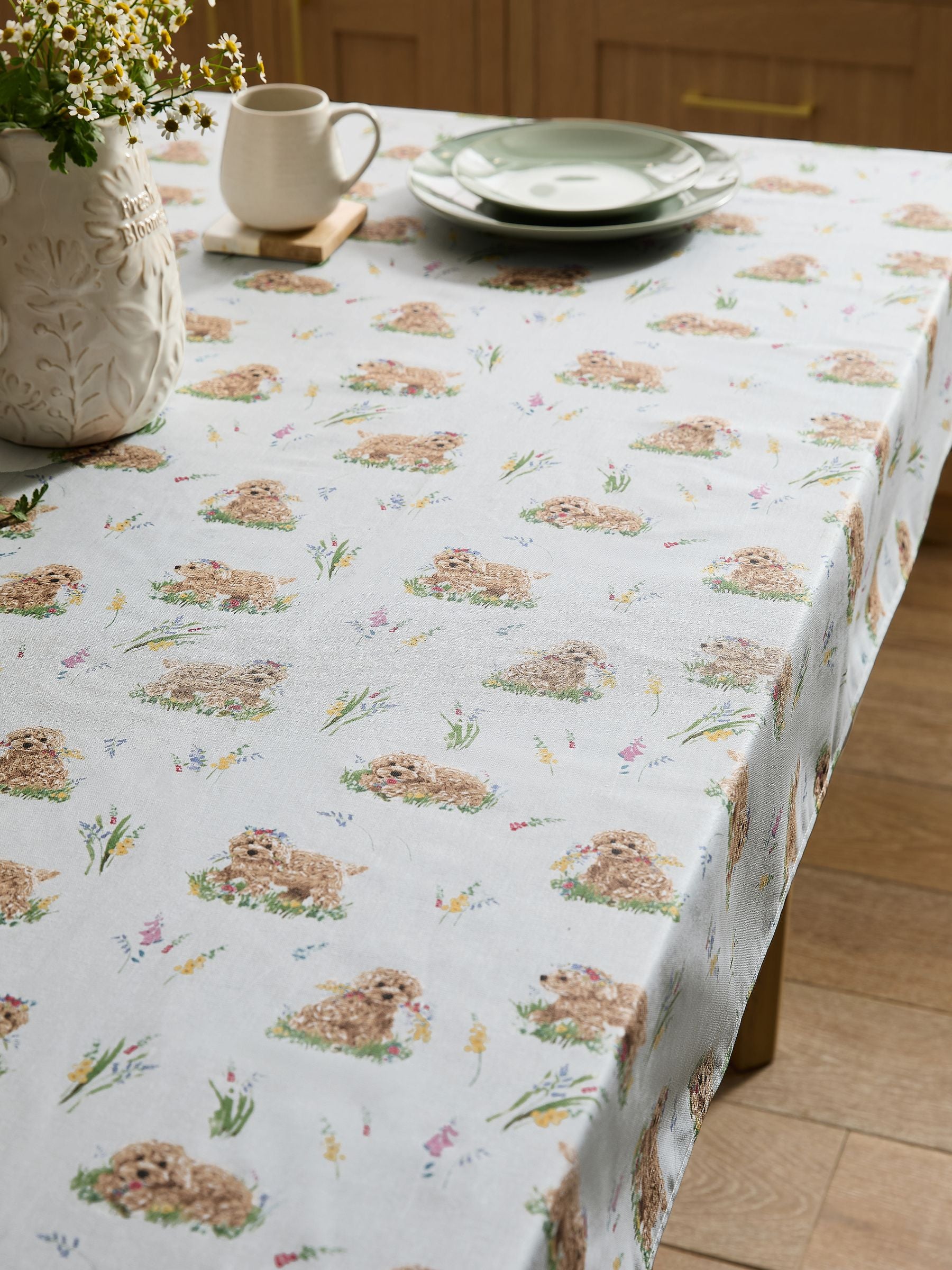 Sage green wipe clean tablecloth featuring Charlie the Cockapoo design (British brand)