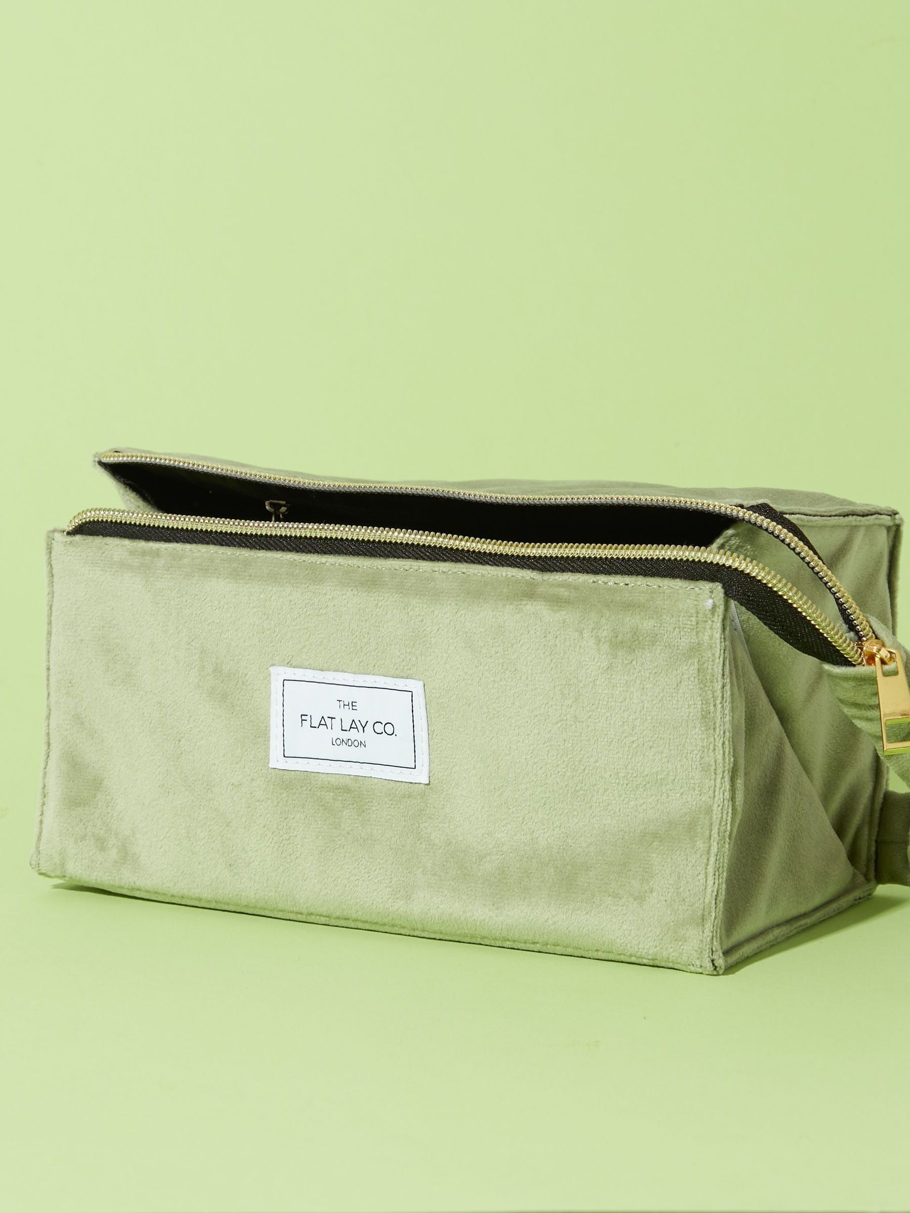Flat Lay Co. sage green velvet makeup bag (British brand)
