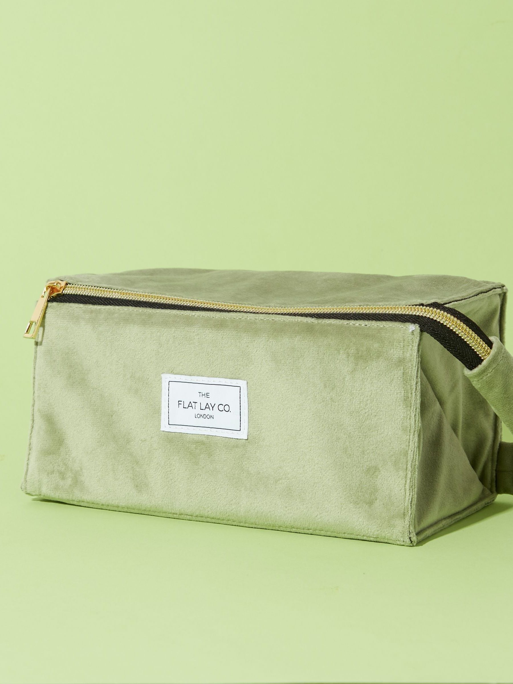 Flat Lay Co. sage green velvet makeup bag (British brand)