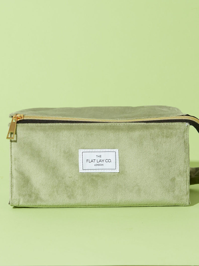 Flat Lay Co. sage green velvet makeup bag (British brand)