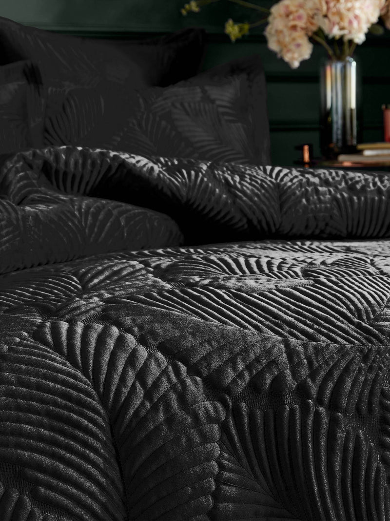 Paoletti Black Palmeria quilted velvet duvet cover set, imported from the UK