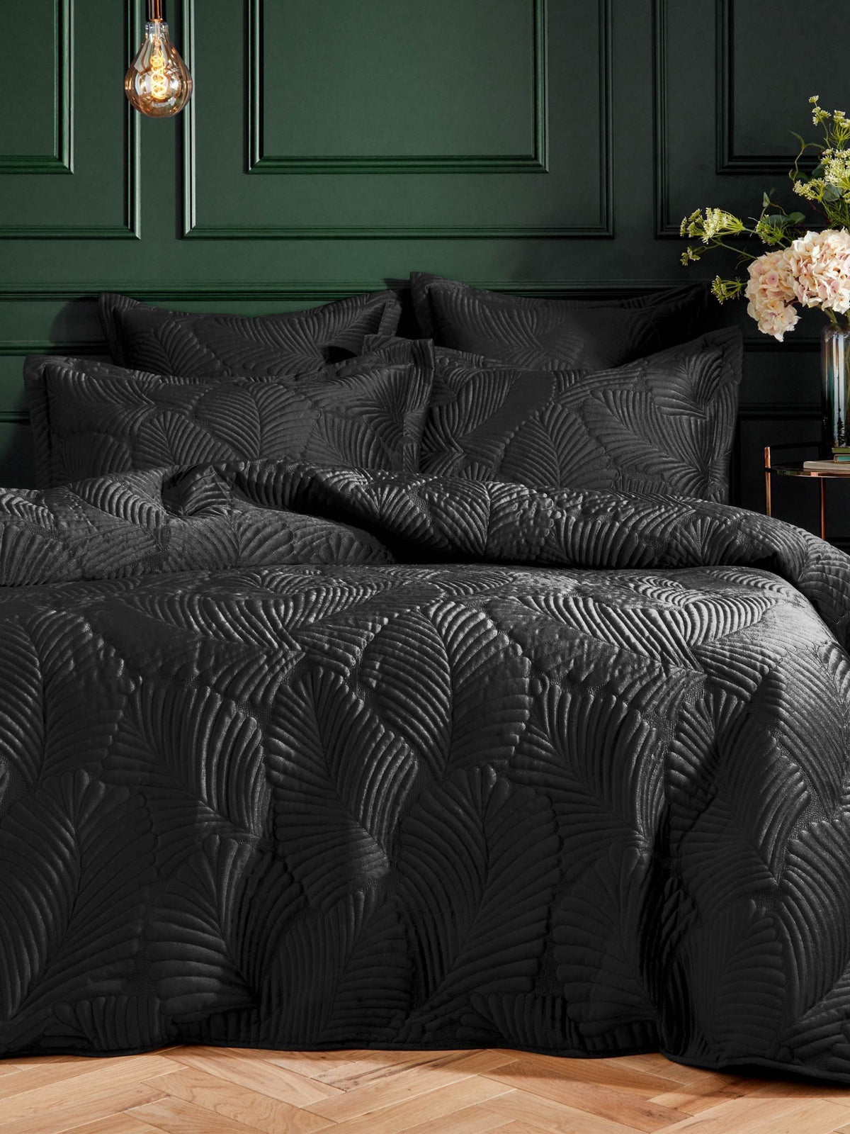 Paoletti Black Palmeria quilted velvet duvet cover set, imported from the UK