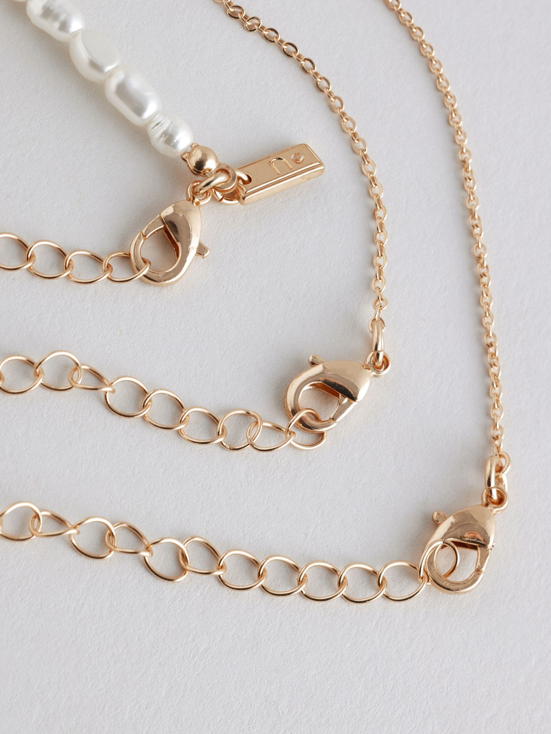Gold tone pearl effect 3 layer necklace, UK version