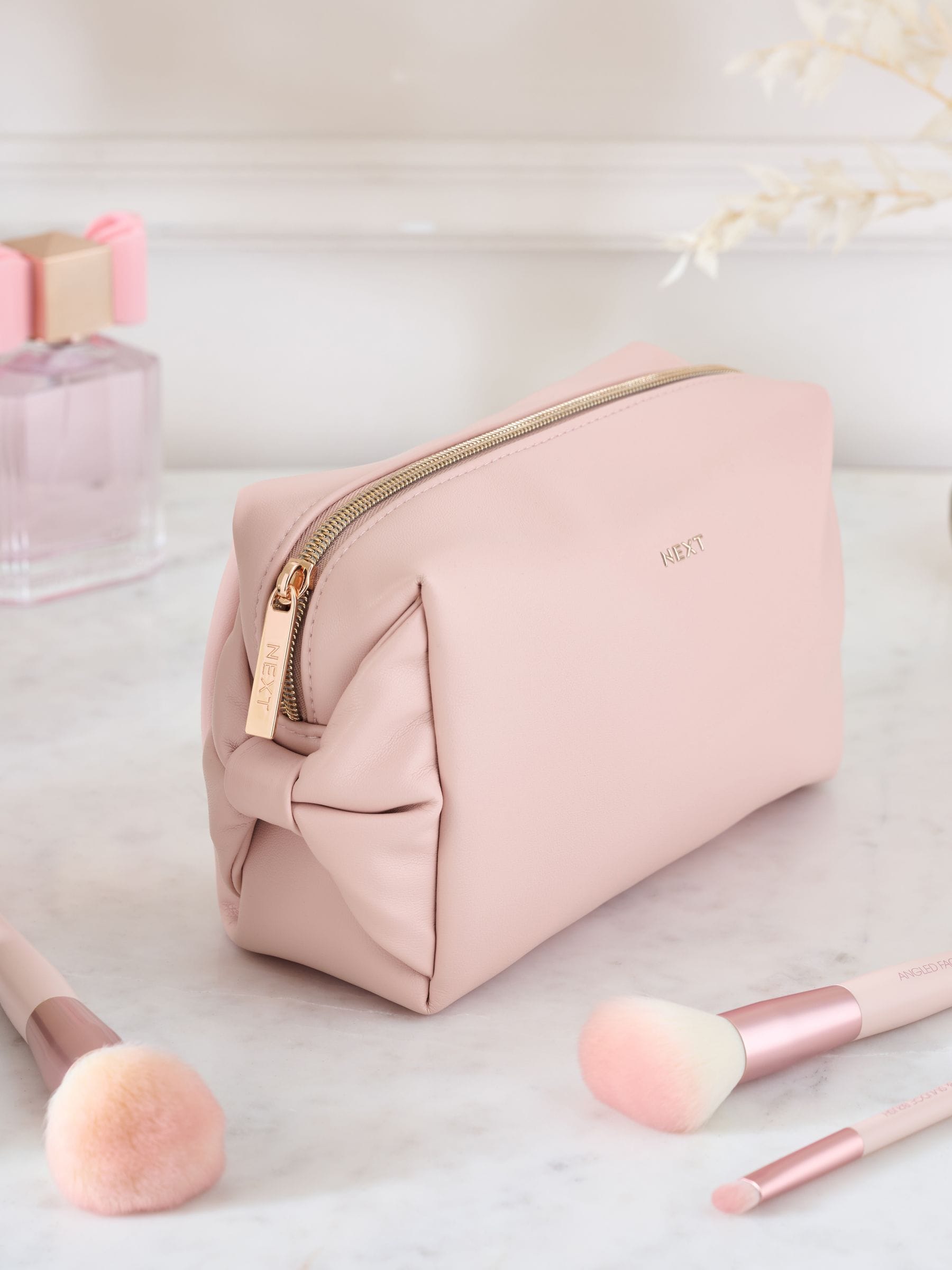 Pink faux leather bow detail makeup bag, imported from the UK