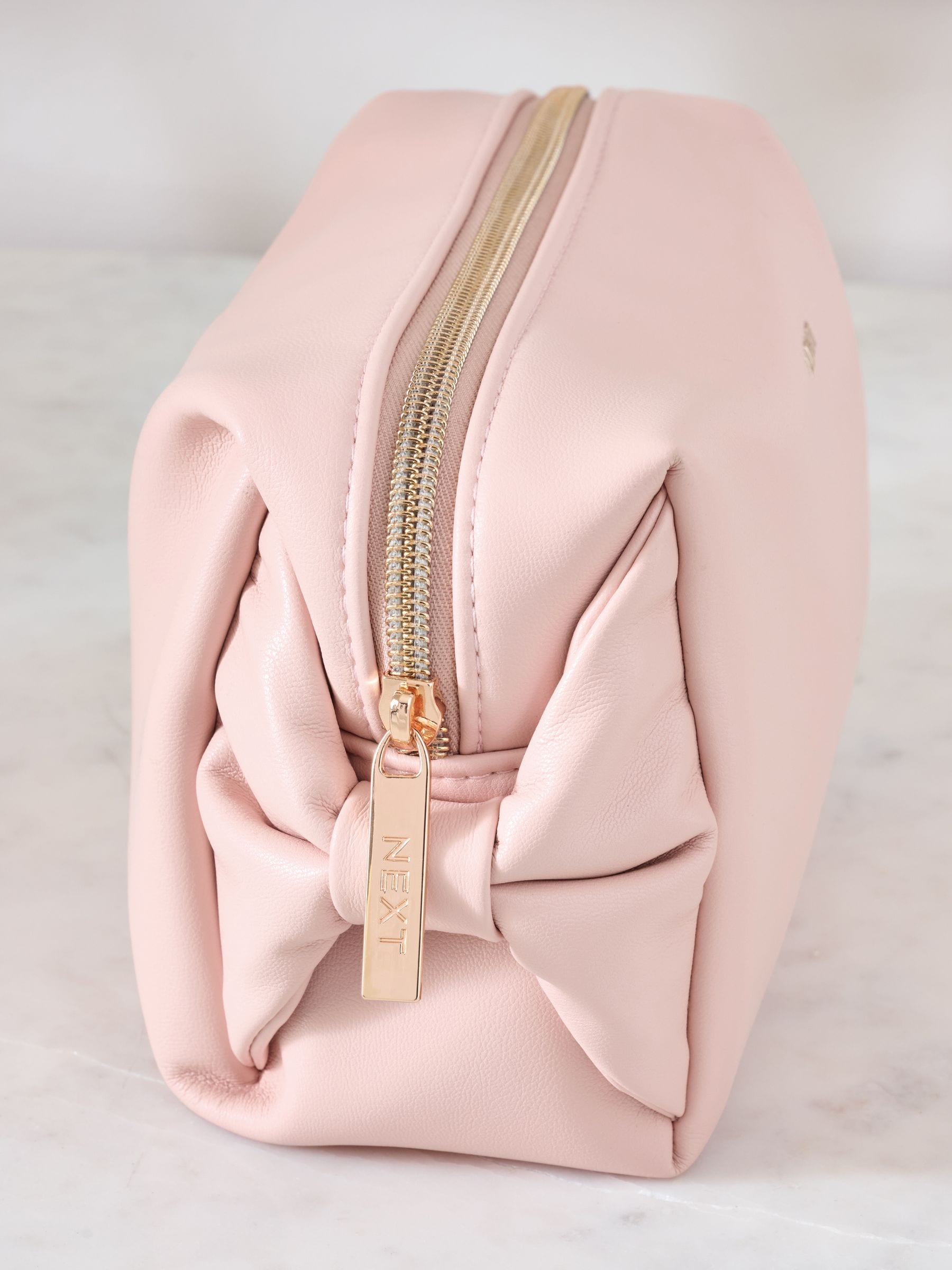 Pink faux leather bow detail makeup bag, imported from the UK