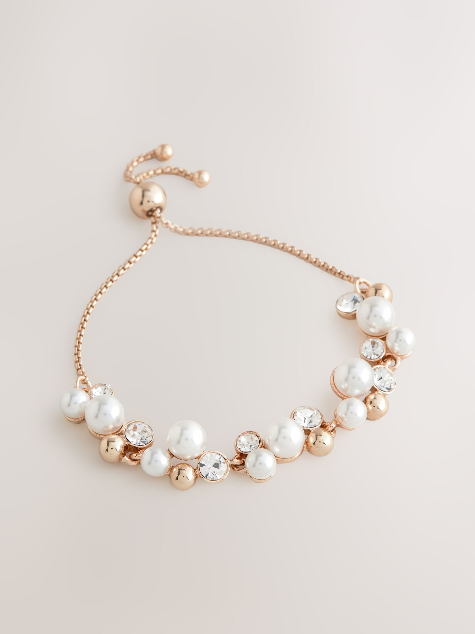 Gold tone sparkle pearl effect pully bracelet, UK version