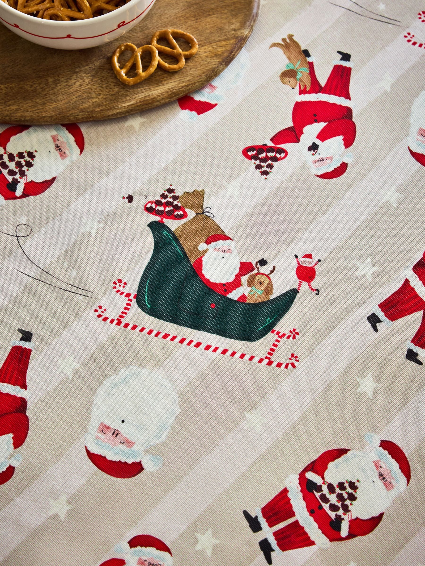 Red Christmas Santa Print Wipe Clean Tablecloth, imported from the UK