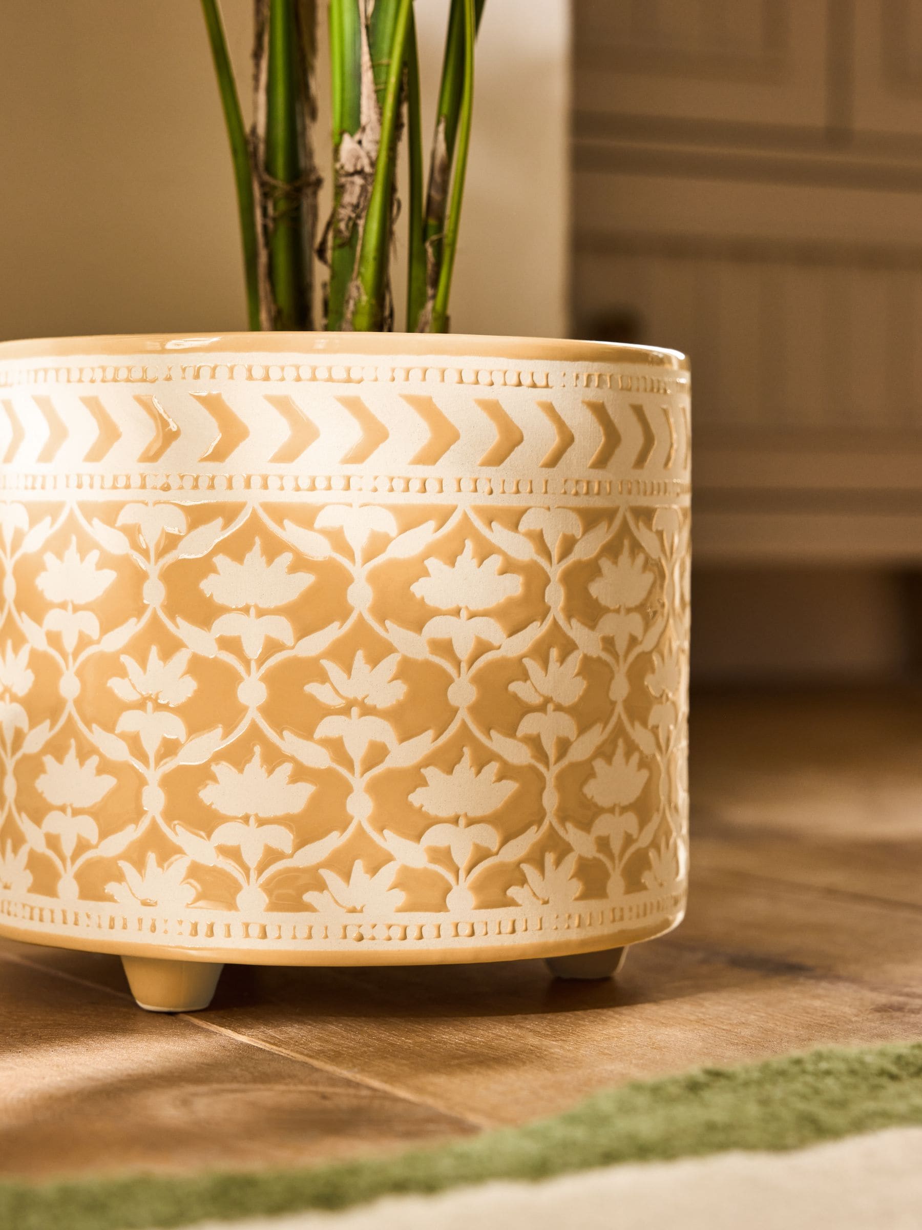 Nina Campbell Ochre Lotus stoneware plant pot with embossed leaf design, imported from the UK.