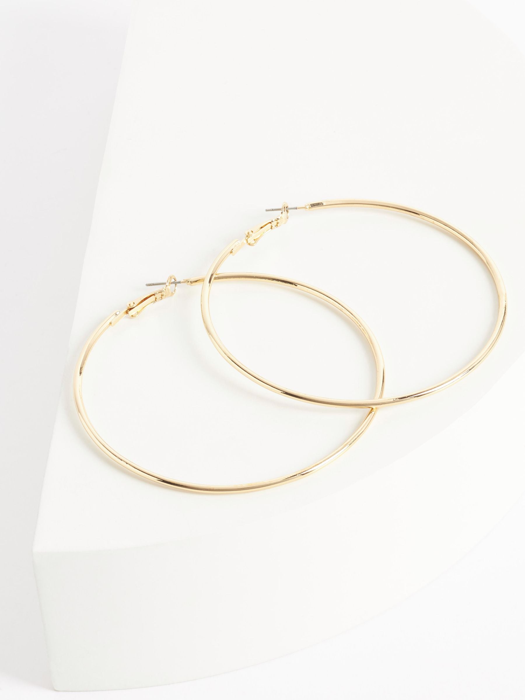 Gold tone oversized hoop earrings, UK version