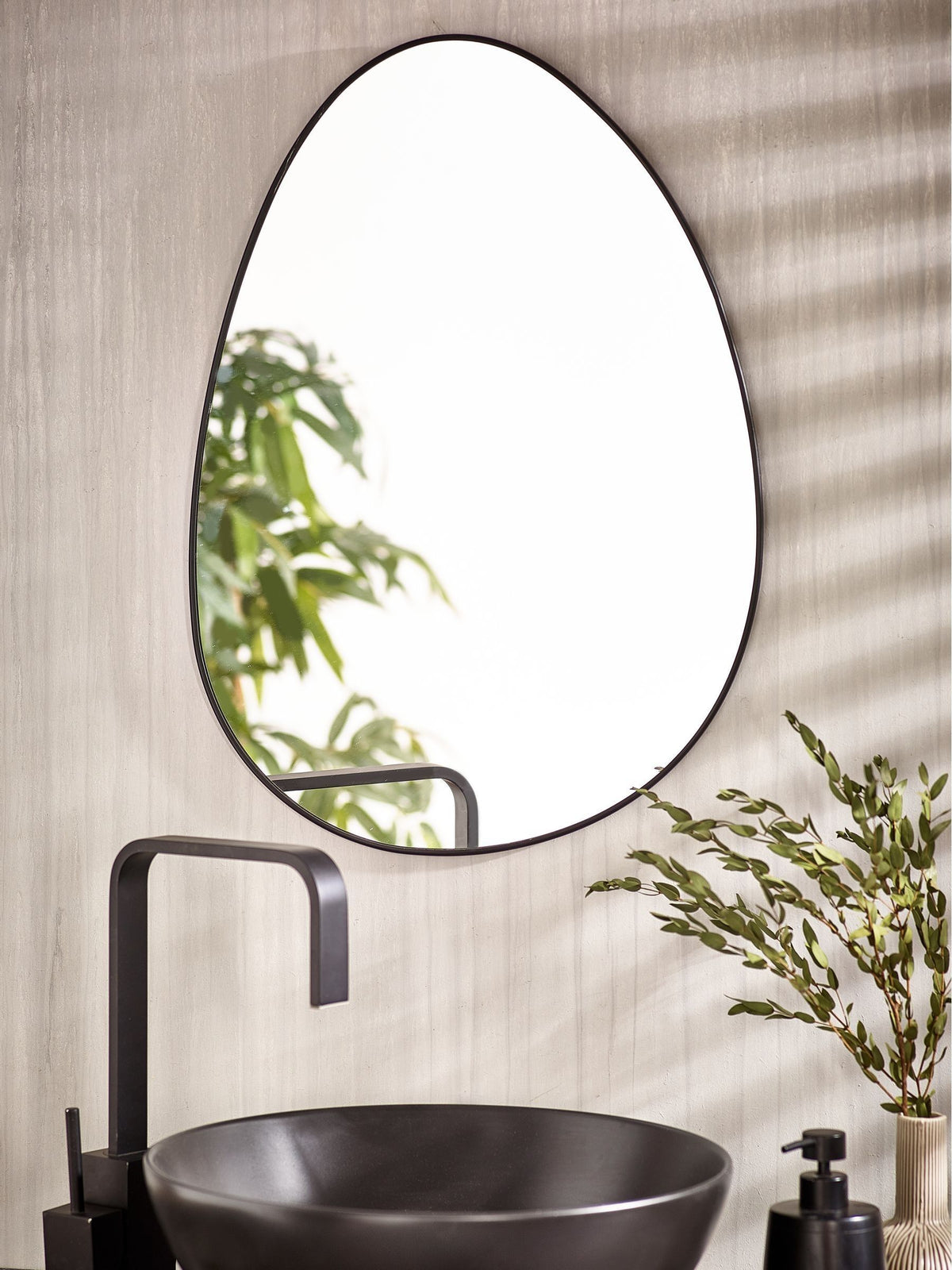 Black pebble round bathroom wall mirror, 62cm x 43.5cm - British product