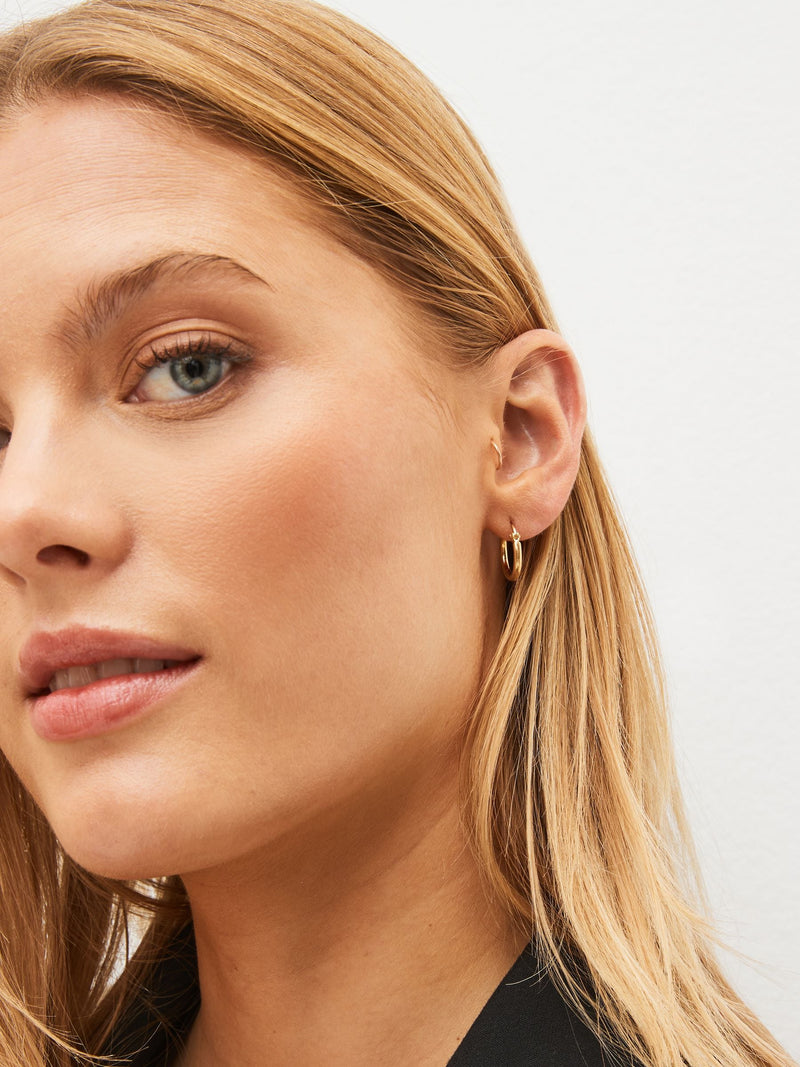 Gold plated sterling silver mini hoop pierced earrings, UK version