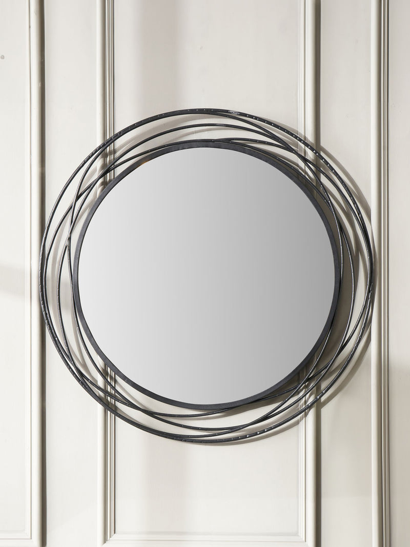 Pacific black metal swirl round wall mirror, imported from the UK
