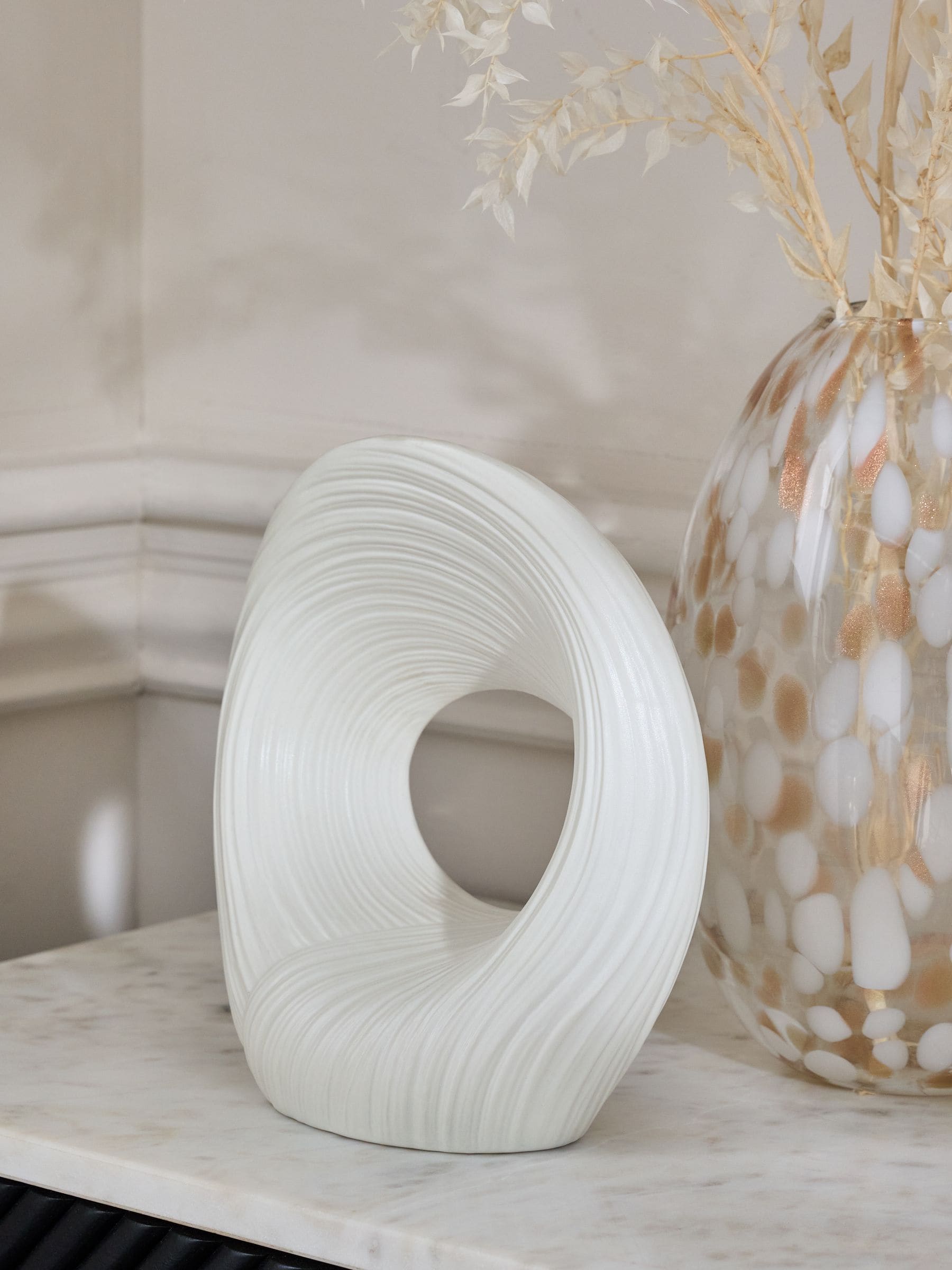 White pleated stoneware ornament with abstract shape (British brand)