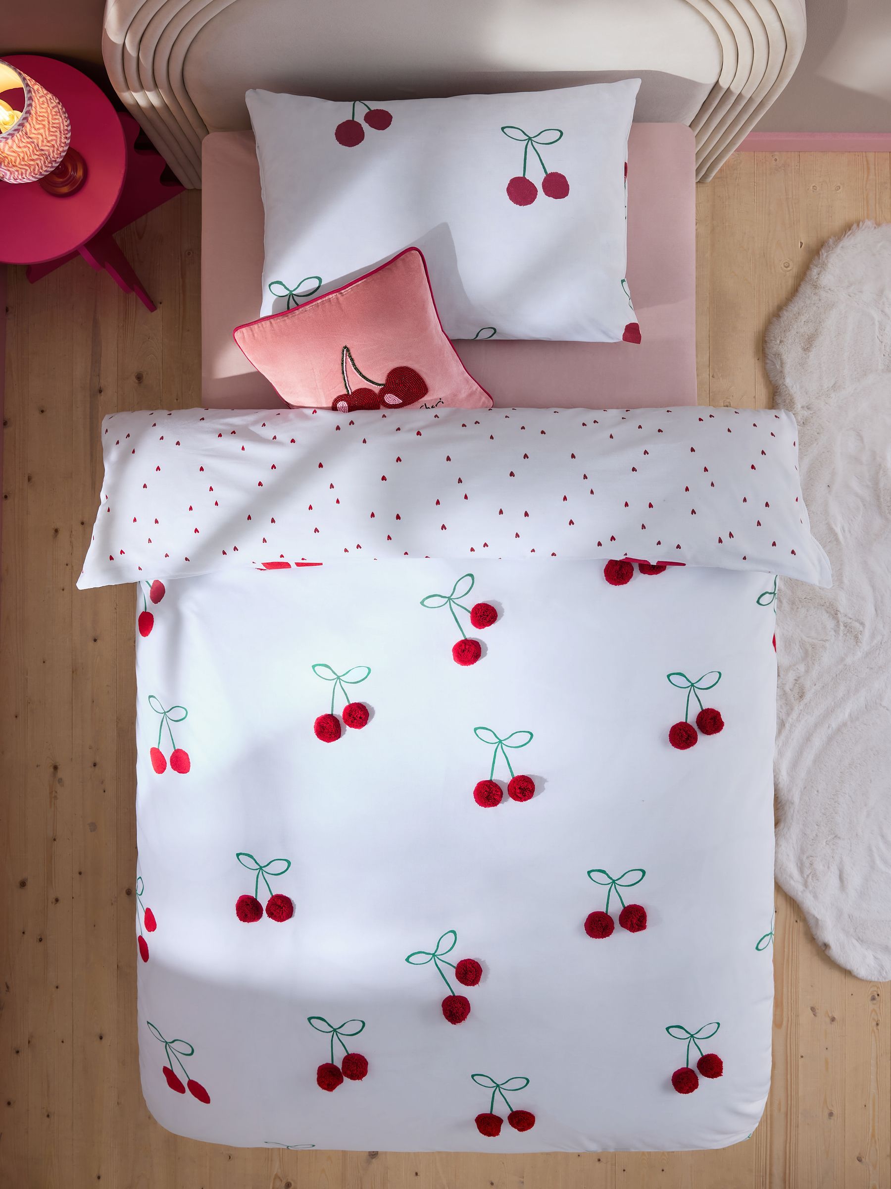 Red Cherry Poms printed polycotton duvet cover and pillowcase set, imported from the UK