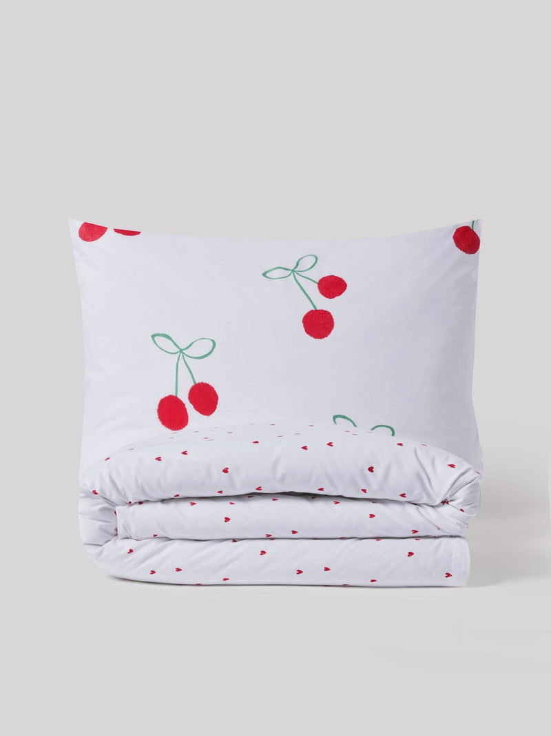 Red Cherry Poms printed polycotton duvet cover and pillowcase set, imported from the UK