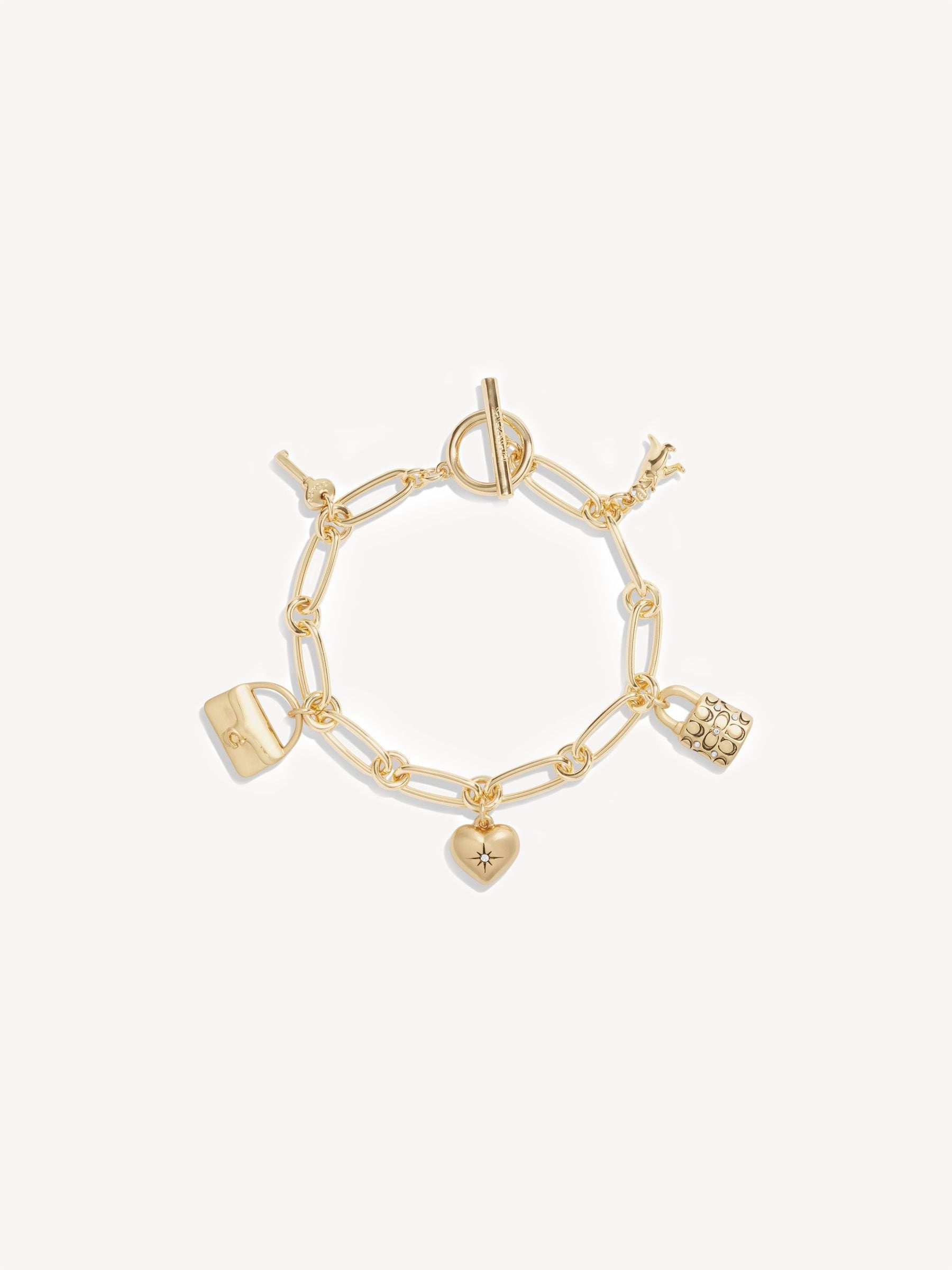 Coach gold tone charm bracelet - British product